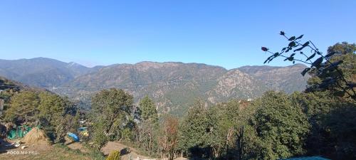 a view of a valley with mountains in the background at The Moon Light Home stay in Bhīm Tāl