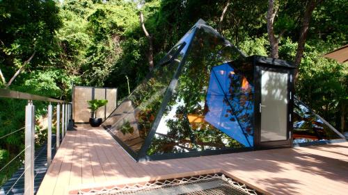 a group of glass sculptures on a walkway at The Pyramid - Glamping at Karuna El Nido in El Nido