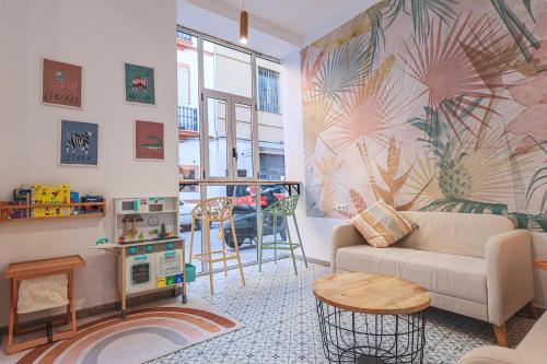a living room with a couch and a table at The Clover in Seville