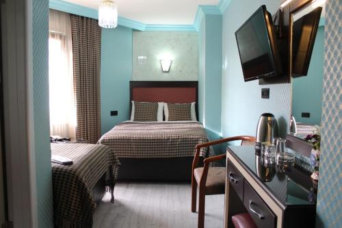 Телевизия и/или развлекателен център в Hotel Falcon