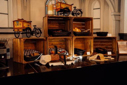a room with wooden shelves with bikes on them at Boutique Hotel, Restaurant & Wellness Westerburcht in Westerbork
