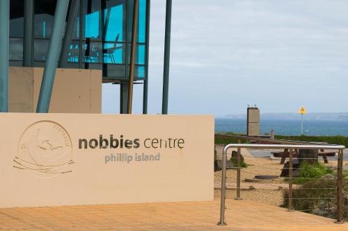a sign for a nocesire philip island at Tropicana Motor Inn in Cowes