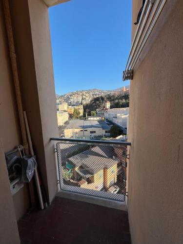 a balcony with a view of a city at Gaslini Sea House in Genova