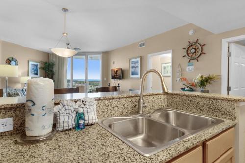 a kitchen with a sink and a counter top at Palms Resort #1814 Jr. 2BR in Destin