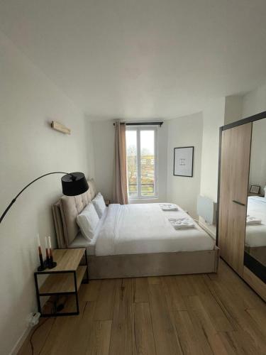 Кровать или кровати в номере Charmant appartement proche Paris et Stade de France !