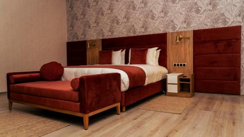 Postel nebo postele na pokoji v ubytování Hotel Ben Batouta - Tanger
