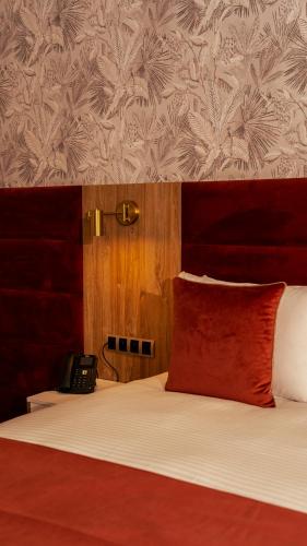 Postel nebo postele na pokoji v ubytování Hotel Ben Batouta - Tanger