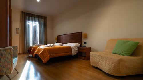 Una cama o camas en una habitación de Le Cupoline