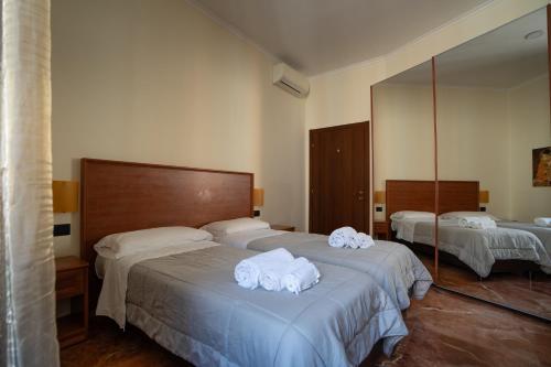 Una cama o camas en una habitación de Le Cupoline