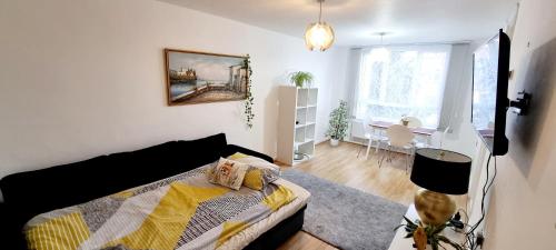 a bedroom with a bed and a living room at NEW - Serviced Apartment - Exel & O2 & Canning Town - home away from home in London
