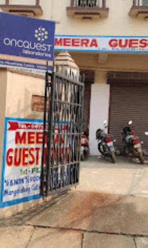 a group of motorcycles parked in front of a store at Meera Guest House,Cuttack in Cuttack