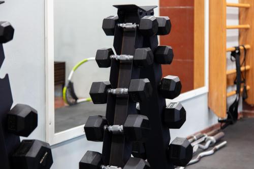 a lego robot with weights on a wall at City Tower Hotel in Kuwait