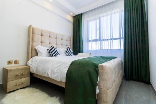 Ένα ή περισσότερα κρεβάτια σε δωμάτιο στο Luxury 1bdrm with an extra room Valley heights Kilimani
