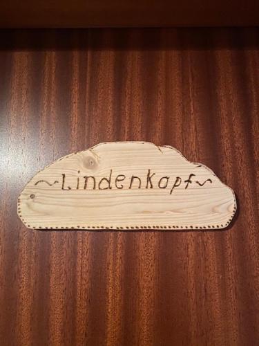 a white cake sitting on top of a table at Alpenappartements Schwalbennestl in Mittenwald