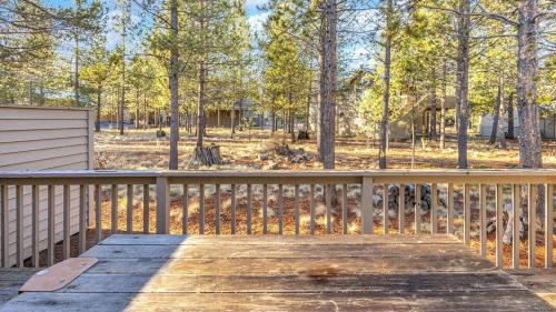 a wooden deck with a view of a park at Big Leaf - Unit 6 in Sunriver