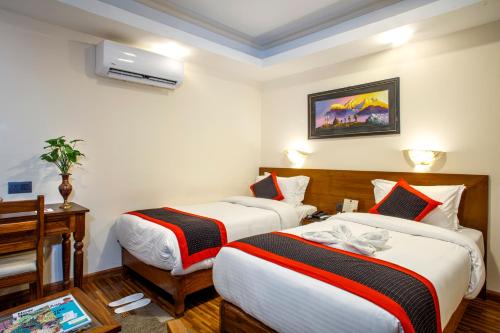 Postel nebo postele na pokoji v ubytování Taleju Boutique Hotel