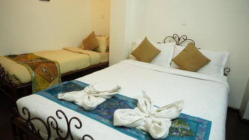 Postel nebo postele na pokoji v ubytování Cosy Hotel