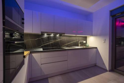 Una cocina o cocineta en SuiteDreams - Bali Suite Liège
