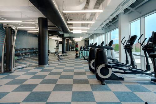 a gym with treadmills and elliptical machines at Aloft Oklahoma City Downtown – Bricktown in Oklahoma City