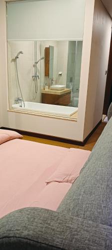 a bathroom with a tub and a sink and a mirror at 超赞海景高级公寓 浪漫香薰浴缸泡澡 Nexflix YouTube WiFi 喜欢浪漫宁静的您怎可错过 in Nusajaya