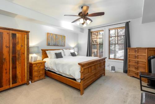 a bedroom with a bed and a ceiling fan at Town Pointe A105 in Park City