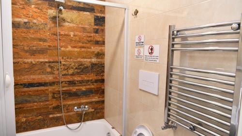 a bathroom with a shower and a toilet and a sink at Costa Costa Rooms in Sant'Egidio del Monte Albino
