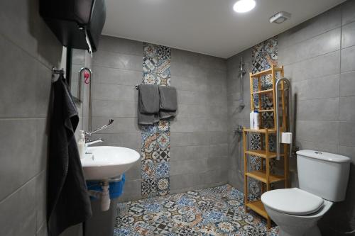 a bathroom with a toilet and a sink at Large Kamara Studio in Nicosia