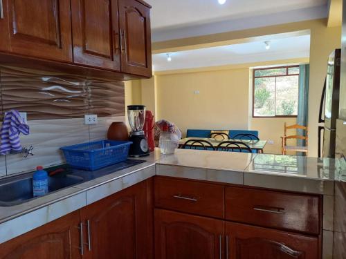 a kitchen with a sink and a counter top at Fundo San Silvestre in Huaraz
