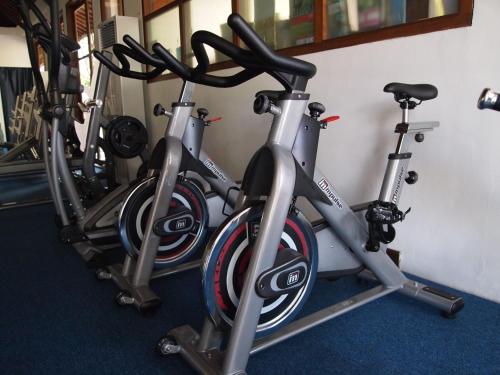 a row of bikes parked next to a wall at Ajanta Villa in Sanur