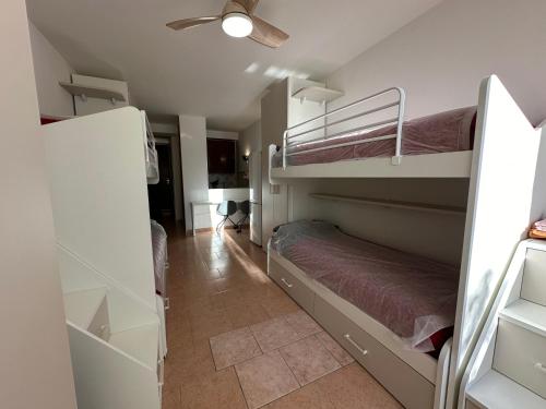 a room with two bunk beds and a hallway at Einaudi Sweet Home - Cologno Monzese in Cologno Monzese