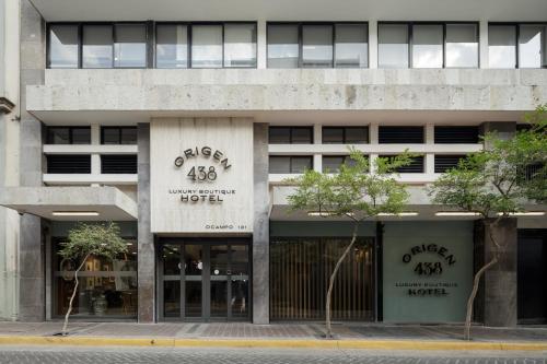 a building with a sign on the front of it at Origen 438 Luxury Boutique Hotel in Guadalajara