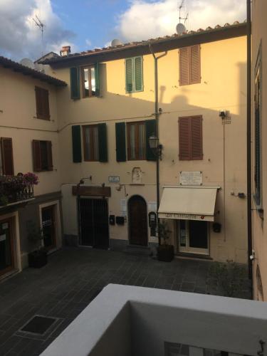 an outside view of a building with a white awning at L'ARCO E' DI FIO in Camaiore