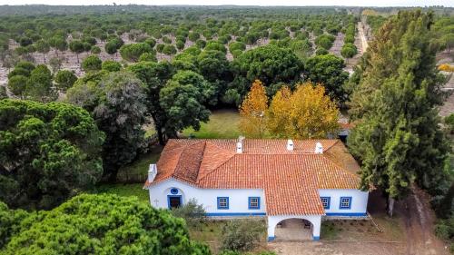 an aerial view of a white house with an orange roof at Casas do Chaparral in Grândola