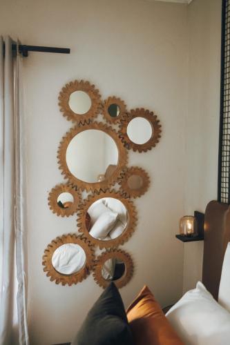 a bathroom with mirrors on the wall at Arched Farmstead in Eerstegoud