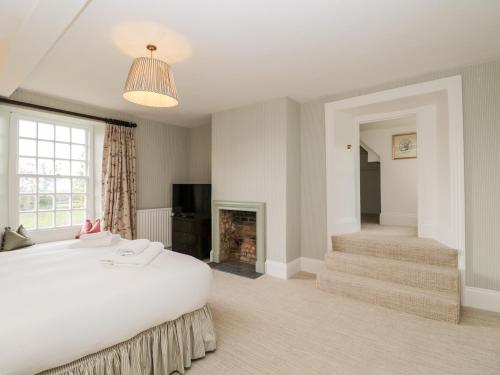 מיטה או מיטות בחדר ב-Wood Stanway House