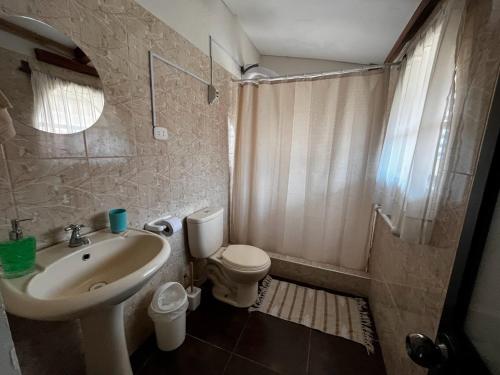 a bathroom with a sink and a toilet and a shower at Casa San Lorenzo in Huánuco