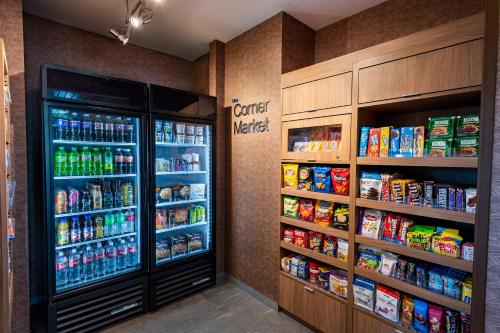 a grocery store with a refrigerator and shelves of food at Fairfield Inn & Suites by Marriott Phoenix West/Tolleson in Phoenix