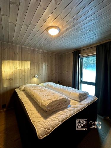 Ένα ή περισσότερα κρεβάτια σε δωμάτιο στο New cabin with sauna and ski in out
