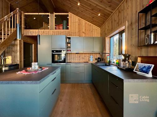 Η κουζίνα ή μικρή κουζίνα στο New cabin with sauna and ski in out