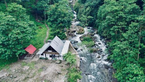 an aerial view of a house next to a river at Chumang River Nest in Thode