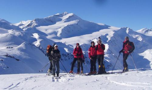 a group of people on skis on a snowy mountain at Ferienwohnungen Auhaus in Martello