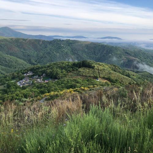 a view of a mountain with a town in the middle at Boutique Finca esencial Hotel Rural in Villafranca del Bierzo