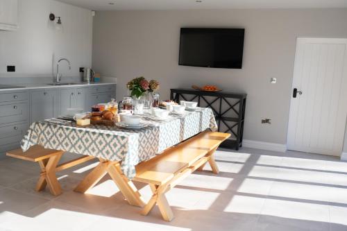 a kitchen with a table with food on it at Lakeview Barn, sleeps 5-7 Guests new inside in Matlock