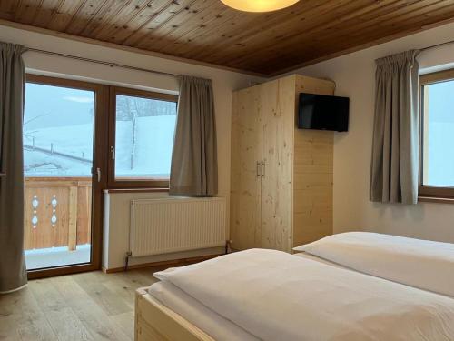 Ένα ή περισσότερα κρεβάτια σε δωμάτιο στο Apartment Obergruberhof