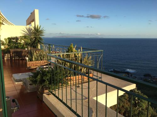 a balcony with a view of the ocean at OceanView Penthouse in Caniço
