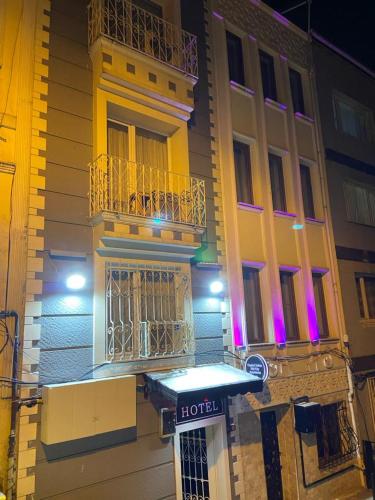 a hotel sign in front of a building at night at Reggae in Istanbul