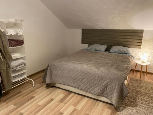 a bedroom with a bed and a closet at Casa Bella Fruška Gora with HOT TUB in Velika Remeta