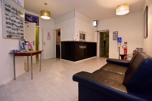 TV a/nebo společenská místnost v ubytování Ambiente by Next Inn