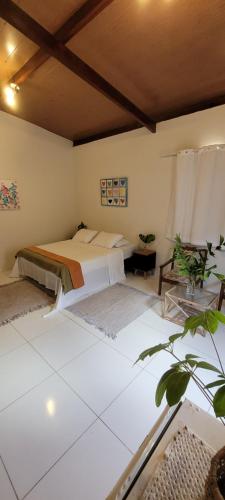 a bedroom with two beds in a room at Casa de Dan in Pipa