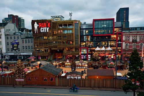 a group of buildings in a city with christmas markets at Ambiente by Next Inn in Hamburg
